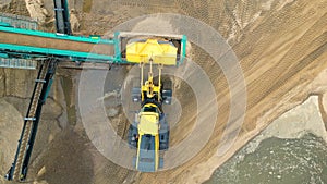 Sand mining industry. Bulldozer machine. Crawler bulldozer moving at sand mine. Mining machinery working at sand quarry. Drone