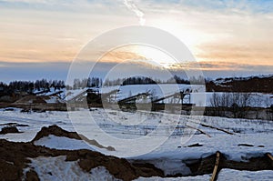 Sand mining in winter conditions in an industrial quarry.