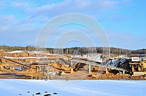 Sand mining in winter conditions in an industrial quarry