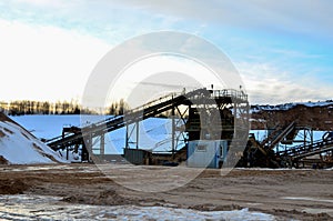 Sand mining in winter conditions in an industrial quarry.