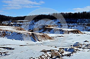 Sand mining in winter conditions in an industrial quarry. Conveyor Belt in mining quarry
