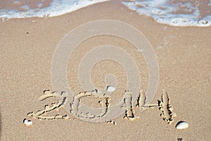 Sand number 2014 on beach