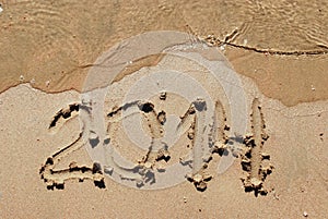 Sand number 2014 on beach