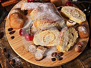 Sand nut chocolate cookies and rolled biscuit on board