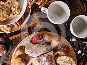 Sand nut chocolate cookies and rolled biscuit on board