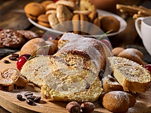 Sand nut chocolate cookies and rolled biscuit on board