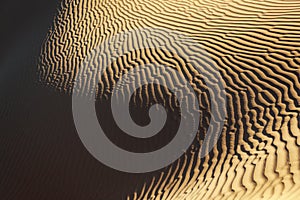 Sand pattern with deep shadows in the Sahara desert.
