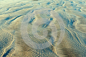 Sand patterns on the beach in Bayshore, Oregon, USA