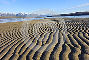 Sand patterns at the beach at low tide on a sunny day