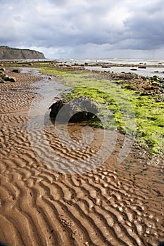 Sand patterns on Robin Hoods Bay beach photo