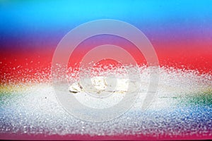 Sand photographed in the studio with color foils before the flash