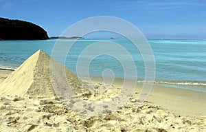 Sand pyramid on beach