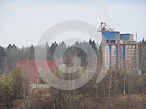 Sand quarry building and workshop with heavy duty machinery. Construction industry. Horizontal