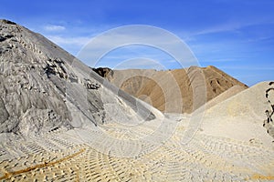 Sand quarry mounds of varied sands color photo