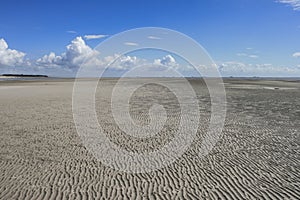 Sand ripples at low tide photo