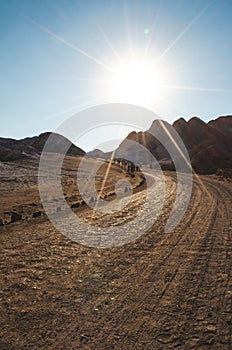 Sand road with hill in the background at Atacama desert, Chile