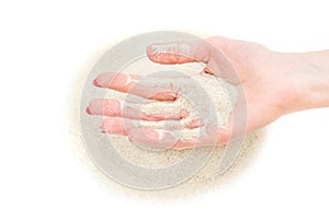 Sand running through female's hand on heap. Isolated on white. Time running out concept. Top view