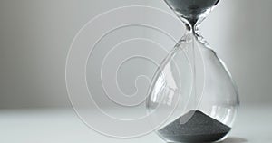 Sand running through the hourglass