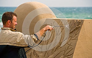 Sand sculptor work on beach