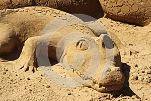 Sand sculpture alligator