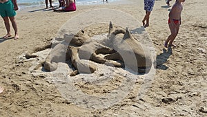 Sand sculpture depicting shark and octopus, beach of Vasto Italy
