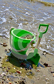 Sand sea shells bucket and spade with
