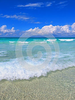 Sand, sea, sky e cloudy... tropical beach with small waves. Enjoy your time!