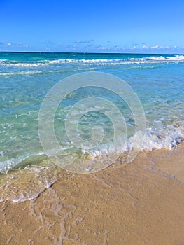 Sand, sea, sky e cloudy... tropical beach with small waves. Enjoy your time!