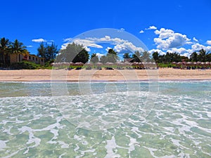 Sand, sea, sky e cloudy... tropical beach with small waves. Enjoy your time!