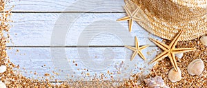 Sand seashells baner background. Summer time concept with sea shells and starfish on wooden background and sand