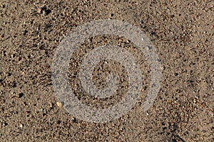 Sand with small stones.