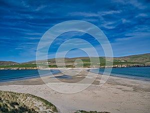 The sand spit, or tombolo, that joins St Ninian`s Isle to Mainland Shetland photo