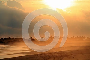 Sand Storm over Pacific Ocean Sandy Beach at Sunset