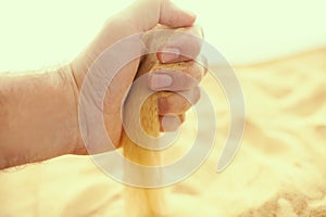 Sand strewing from hand