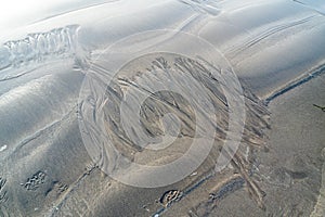 Sand surface with irregural wind pattern after storm