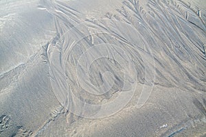 Sand surface with irregural wind pattern after storm