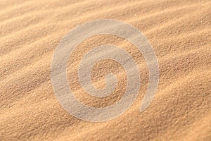 Sand texture - background of desert sand dunes. Beautiful structures of sandy dunes. sand with wave from wind in desert