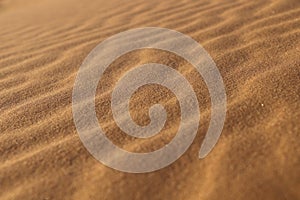 Sand texture - background of desert sand dunes. Beautiful structures of sandy dunes. sand with wave from wind in desert