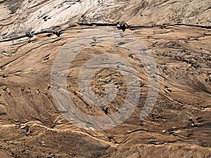 Sand texture background with traces of water flowing