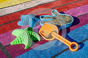Sand Toys On A Colorful Beach Towel