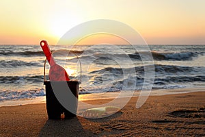 Sand toys for making sand castle on sandy beach in sea shore at sunset time , summer holiday vacation at tropical island