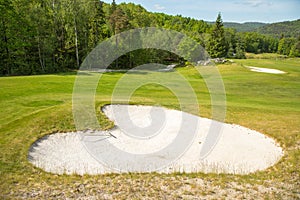 Sand trap in a golf course sand bunkers heart shape