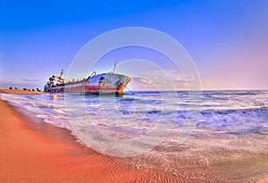 Sand trapped ship in kollam beach photo