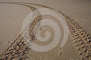 Sand tyre mark background. tire track shape lines on dry brown sand mud vehicle wheel shape
