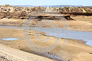 Sand, water and dunes of Ria de Alvor, Portugal photo