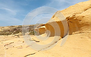 Sand wave, stone arch of Gozo, Malta
