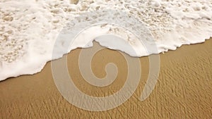 Sand and waves on the beach