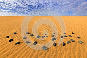 Sand waves in the wild nature. Dunas Maspalomas, Gran Canaria, Spain. Yellow sand. Sand desert with beautiful rare blue sky with w photo