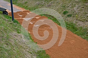 Sand wheeling. garden wheelbarrow carries a worker and pours on piles of beige gravel to repair park, forest, dirt road. erosion c