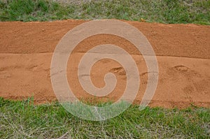 Sand wheeling. garden wheelbarrow carries a worker and pours on piles of beige gravel to repair park, forest, dirt road. erosion c